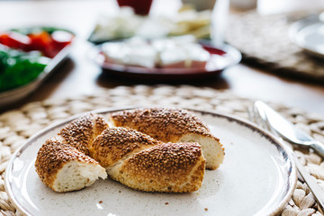 Turkish traditional Breakfast with bagel (Turkish Simit), blur background and in front of the photo there is Turkish Bagel