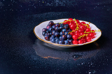 Fresh washed blueberries with drops of water on a background