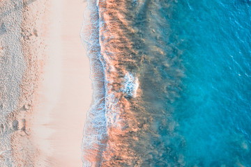 Top down of waves hitting Makena Beach at sunset, Maui, Hawai, USA