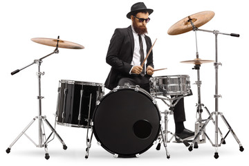 Fototapeta na wymiar Elegant male drummer playing a drumkit