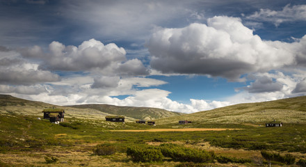 Small wooden mountain cabins in Rondane mountains, Norway.