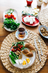 Turkish traditional Breakfast with bagel (Turkish Simit), blur background and in front of the photo there is Turkish Bagel