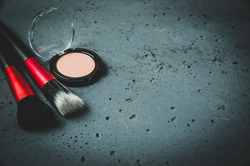 Make-up brush on stone background. Fashion and beauty concept. Taking care of yourself,...