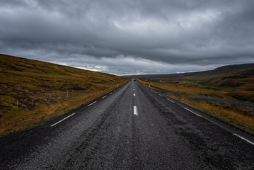 Fototapeta na wymiar Asphalt road High way Empty curved road cloudy sky in september 2019