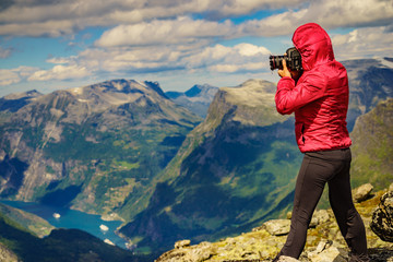 Fototapeta na wymiar Tourist taking photo from Dalsnibba viewpoint Norway