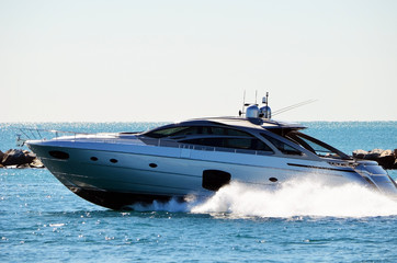 High-end cabin cruiser racing through Government Cut offMiami Beach,Florida