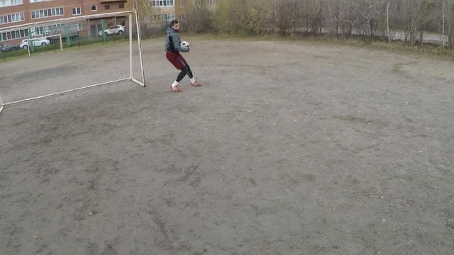 POV Shot Of Athlete Shooting Soccer Ball And Goalkeeper Catching It While Training Together On Outdoor Sports Field