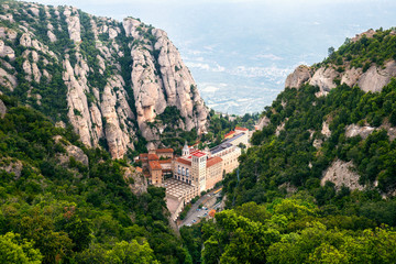 Panoramic view of  Benedictine abbey, Santa Maria de Montserrat, in Montserrat mountains, near...