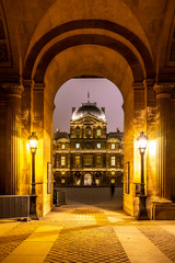 Paris, France - December 5, 2019: The famous square courtyard building of the Louvre Museum at night