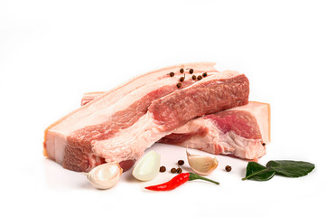 Raw pork meat on wooden board isolated on white