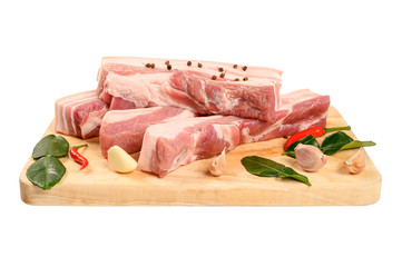 Streaky pork with ingredient on cutting board on white.