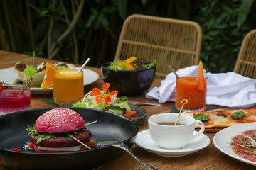 Various healthy vegetarian dishes served on the wooden table