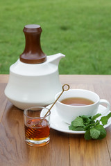 Fresh mint tea served on the wooden table