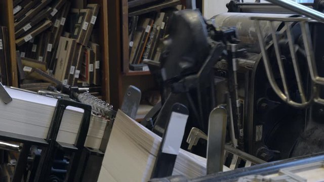 Printed sheets of paper are served in the printing press