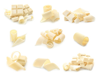 Pieces of chocolate with curls on white background