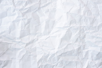 white and gray crumpled paper texture background. crush paper so that it becomes creased and wrinkled.