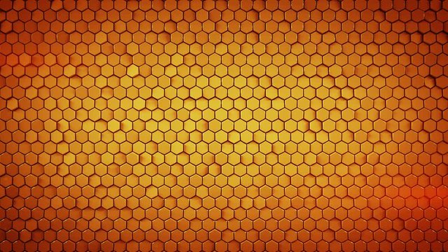Wall of small orange hexagons. Computer generated abstract motion background. Seamless loop 3D render animation 4k UHD (3840x2160)