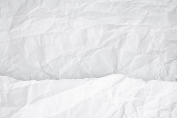 white and gray crumpled paper texture background. crush paper so that it becomes creased and wrinkled.