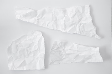 Obraz premium white and gray crumpled paper texture background. crush paper so that it becomes creased and wrinkled.