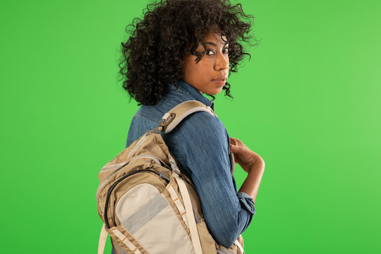 Portrait Of Pretty Black Woman With Backpack On Greenscreen