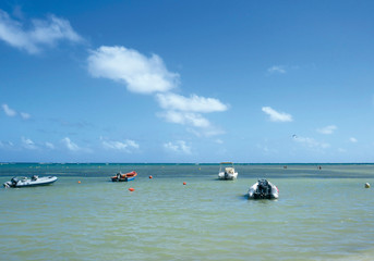  Small boats moored in the Caribbean Sea.  Beach on the French island of Martinique. French West...