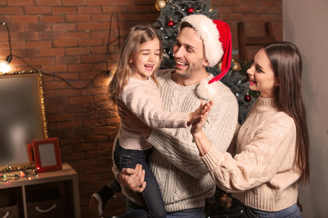 Happy family at home on Christmas eve