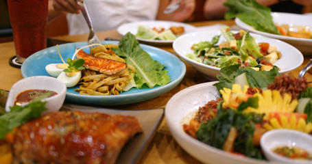 Eat Thai cuisine in restaurant