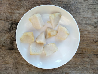 Ketupat or Rice Dumpling On Wooden Background. Ketupat is a natural rice casing made from young coconut leaves for cooking rice during eid Mubarak, Idul Fitri or Aidilfitri