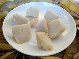Ketupat or Rice Dumpling On Wooden Background. Ketupat is a natural rice casing made from young coconut leaves for cooking rice during eid Mubarak, Idul Fitri or Aidilfitri