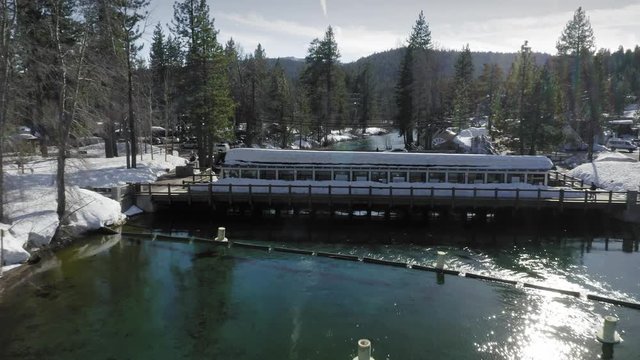 Aerial: Flying over a fresh water catchment on the Truckee River in Tahoe city. Lake Tahoe, USA