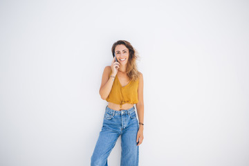 Woman with smartphone standing in relax posture