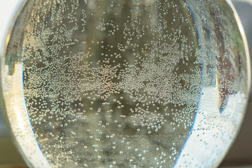 bubbles in a jug of water. glass ball with water. magic ball