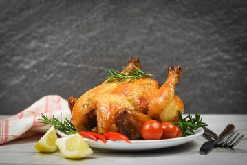 Whole roasted chicken rosemary and chilli lemon - Baked chicken grilled barbecue delicious food on dining table at holiday celebrate
