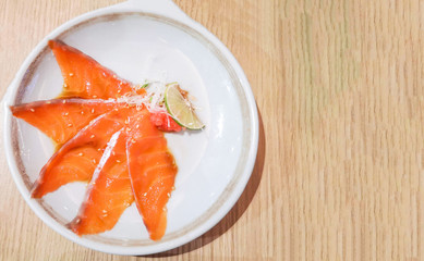 Salmon sashimi menu set Japanese cuisine fresh ingredients on plate - Japanese food raw sashimi salmon fillet on wooden table
