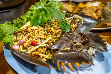 Spicy eggs pimp salad chilli food thai style with Horseshoe crab.