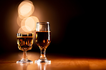 Glasses of Bourbon Whiskey on a Wooden Table with Copy Space