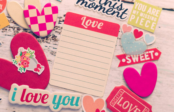 Paper hearts and I Love You tag on white wood background. Happy and warmth moment of lovely couple or family or friend relationship. Love photo concept and romance Valentine day image. Selective Focus