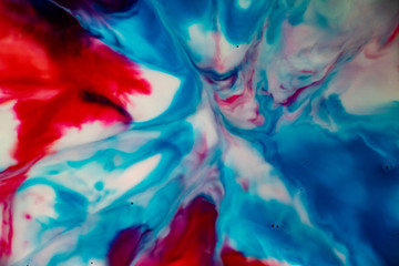 Red and Blue Graphic Explosion. Splatters, cells and splashes of color. A fantasy universe. Hidden images. Paint and ink art on a milky background. Dream images.
