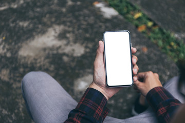 Mockup image blank white screen cell phone.men hand holding texting using mobile. background empty space for advertise text.people contact marketing business and technology 