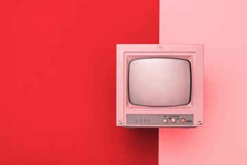 Vintage TV with kinescope on a two-tone background. 