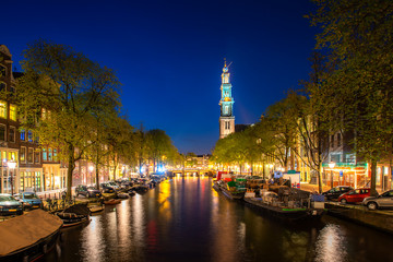 Canals of Amsterdam during twilight in Netherlands. Amsterdam is the capital and most populous city of the Netherlands. Landscape and culture travel, or historical building and sightseeing concept.