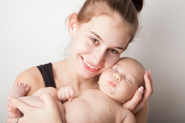 Obraz na płótnie Canvas Teen mother and Newborn baby boy portrait