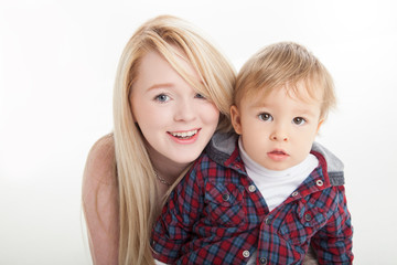 Young mother with little boy on white background