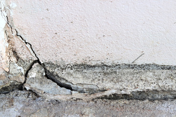 gray concrete wall texture with crack. white or grey stucco cement old texture rough and brown and gray stain dirty. stone grunge design background