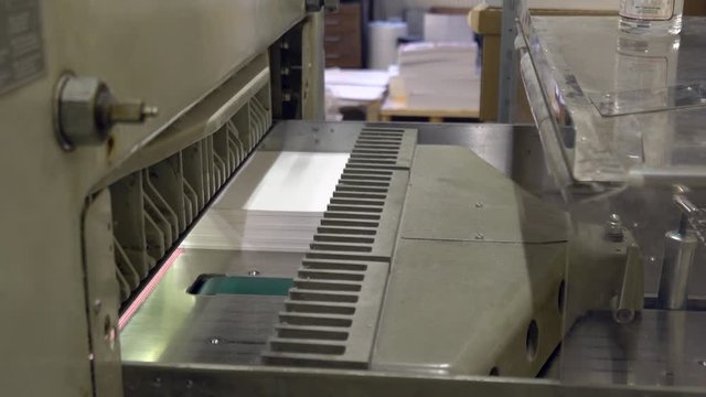 Paper cutting machine at the typography