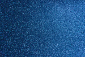 Blurred shining closeup of blue bright texture. Art macro of classic glittering backdrop. Color concept.