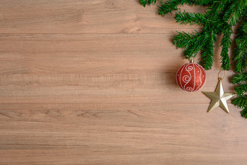 Christmas fir tree with decoration on wooden board