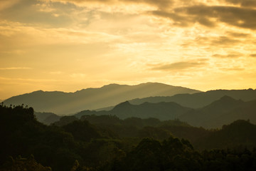 Beautiful mountains and forests with fog.At sunset.