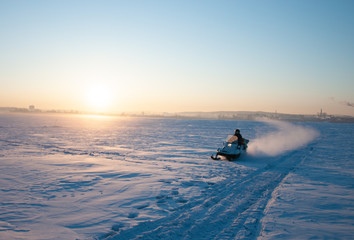 Traveling and outdoor activities in winter on snowmobiles.