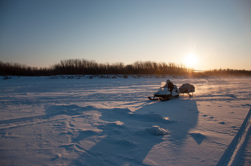 Traveling and outdoor activities in winter on snowmobiles.